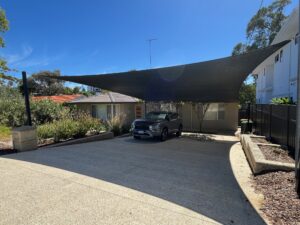 Charcoal Shade Sail on Sloping Driveway with 4 Posts 2.4m High (2)